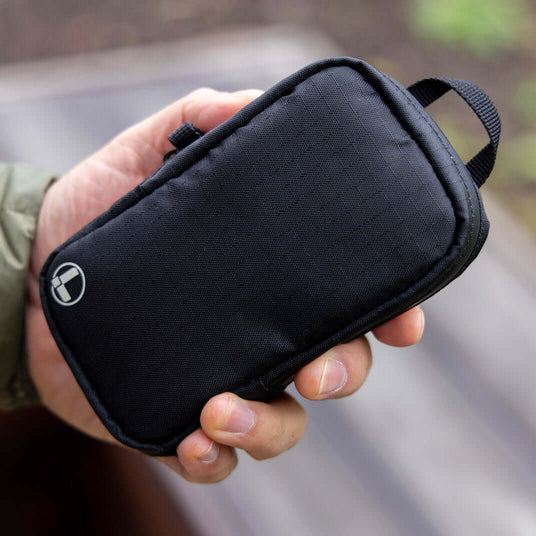 Translation missing: nl.Black Leatherman Tool Pouch held in hand, showcasing a sleek and durable design perfect for organizing tools