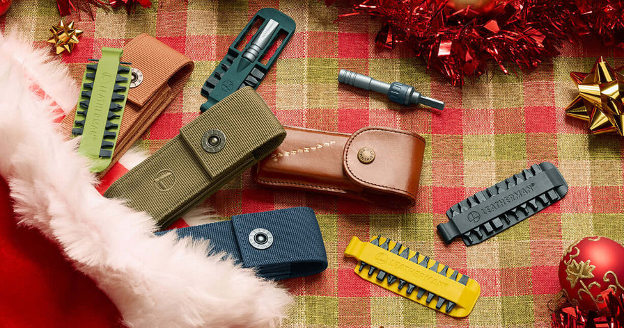 Translation missing: da.Assorted Leatherman nylon sheaths, bit kit, and ratchet driver on a festive background with holiday decorations