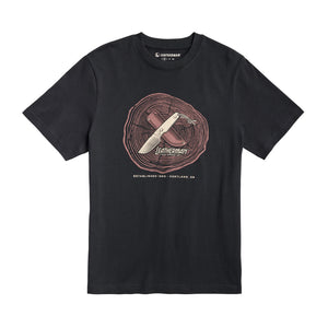 Translation missing: it.Front of the black Leatherman Blade &amp; Grain tee  showcasing a fix blade knife and leather sheath on a stump