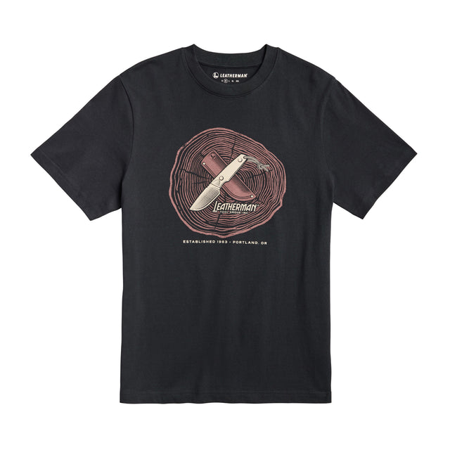 Translation missing: it.Front of the black Leatherman Blade &amp; Grain tee  showcasing a fix blade knife and leather sheath on a stump