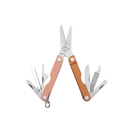 Translation missing: de.Leatherman Micra multitool in Ginger Peach with open scissors, knife, file, tweezers, and other tools