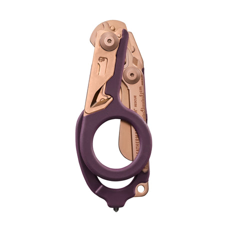Translation missing: de.Folded Raptor® Rescue tool in Rose Gold with purple handles and visible measurement markings on the shears
