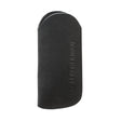 Translation missing: de.A black suede leather tool sleeve featuring an embossed vertical “LEATHERMAN” logo and the company’s circular emblem near the stitched edge, displayed against a white background